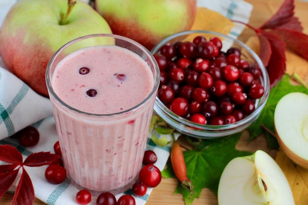 A smoothie with protein powder, cranberries and coconut milk.