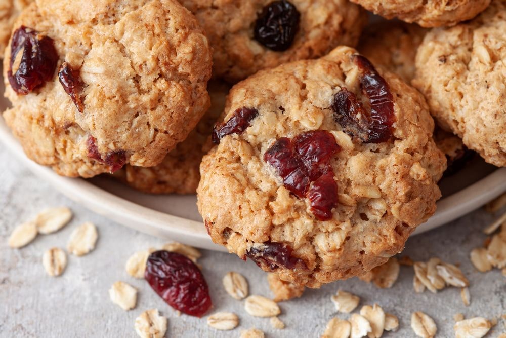 Close up view of a recipe for soft cookies made with oats and cranberries