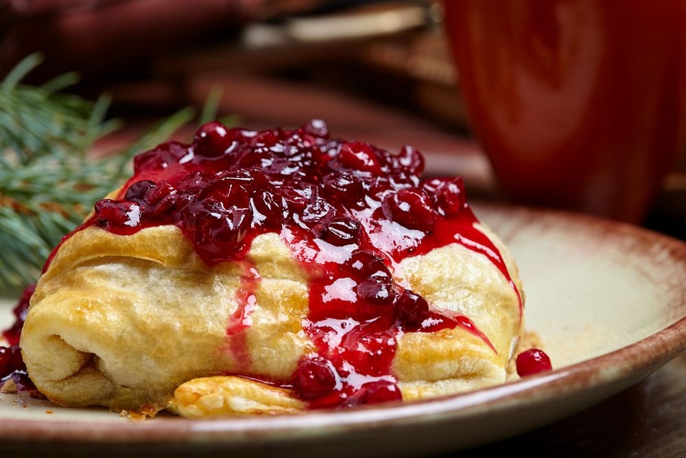 Easy doughy recipe for a dessert that is always a treat and it's stuffed with cranberries
