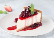 Slice of Cheesecake with a delicious Cranberry Topping - Recipe Included