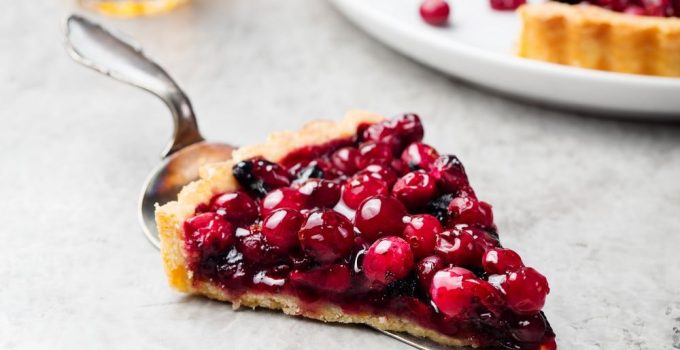 Cranberry tart with mouth watering filling that's all red.