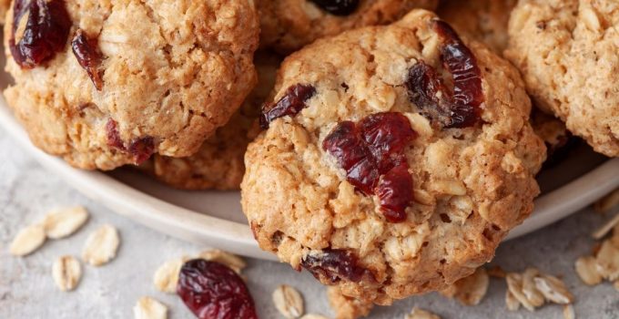 Close up view of a recipe for soft cookies made with oats and cranberries
