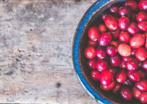 Fresh cranberries that are in a bowl and all-natural