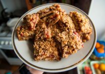 Crumble bars recipe with baked cranberry sauce inside oats and brown sugar.