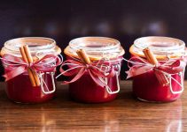 Three jars of a red berry jam made easily at home recipe.