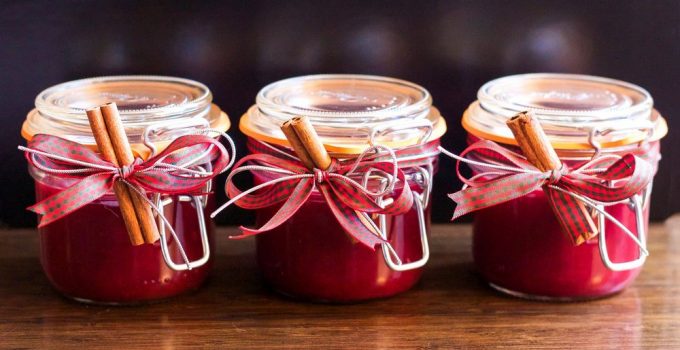 Three jars of a red berry jam made easily at home recipe.