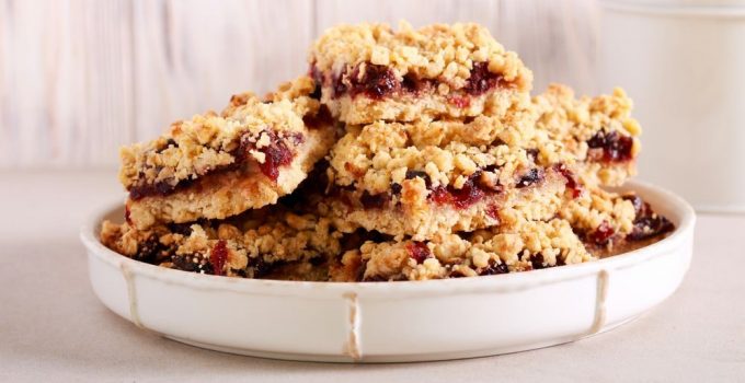 Recipe for a delicious dessert featuring a crumble like topping with cranberry center filling.