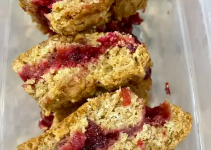Delicious squares of a dessert cut into bars with cranberry center