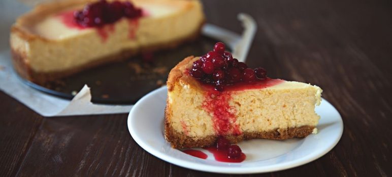 Cheesecake with Graham Cracker crumbs and cranberry topping